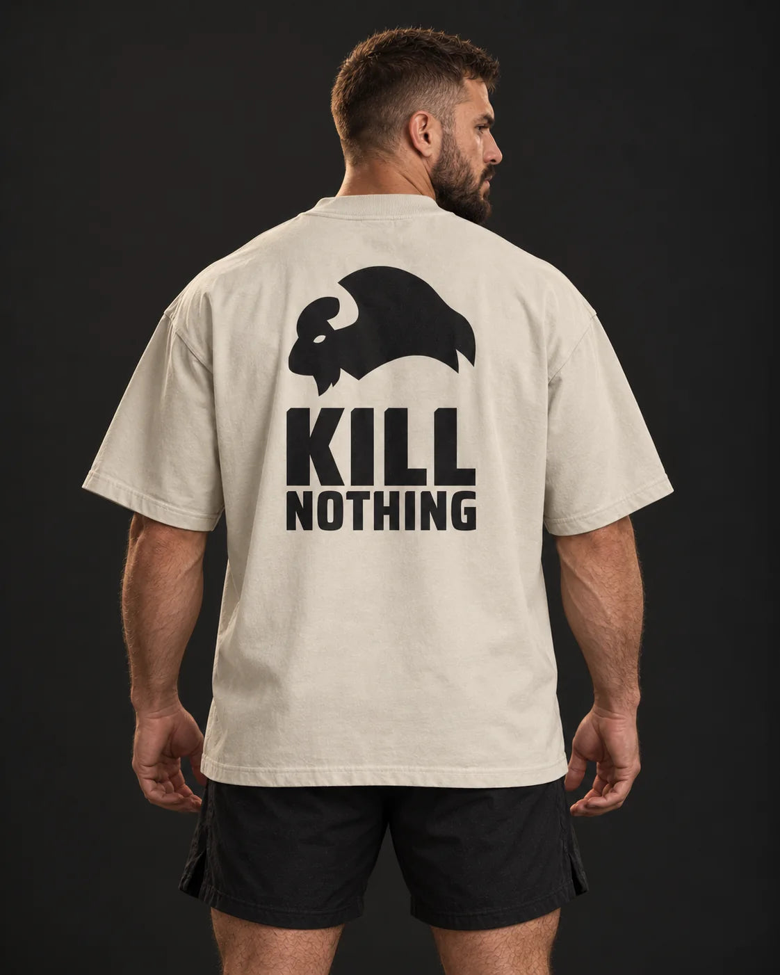Kill Nothing Club - Oversized Tee, stone, worn by an athlete, studio photo (AI-generated image)
