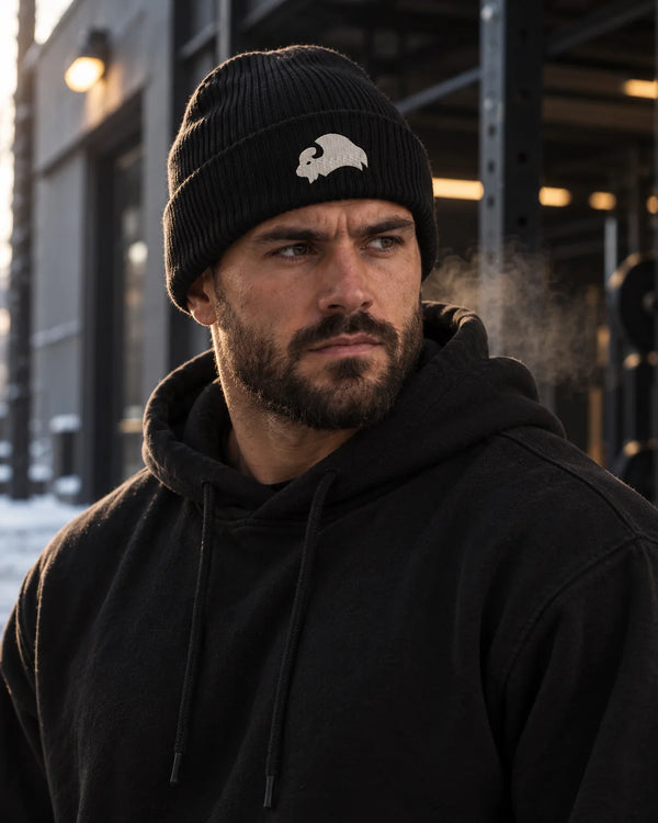 Embroidered Bison - Beanie, black, worn by an athlete in the gym (AI-generated image)