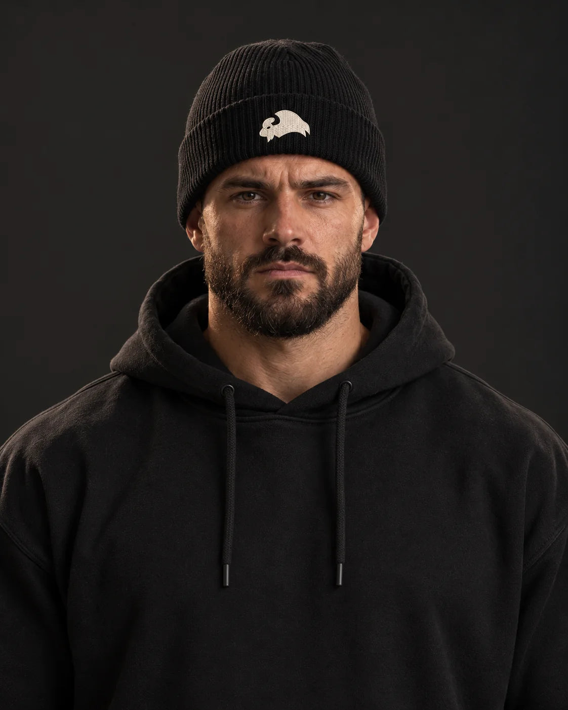 Embroidered Bison - Beanie, black, worn by an athlete, studio photo (AI-generated image)
