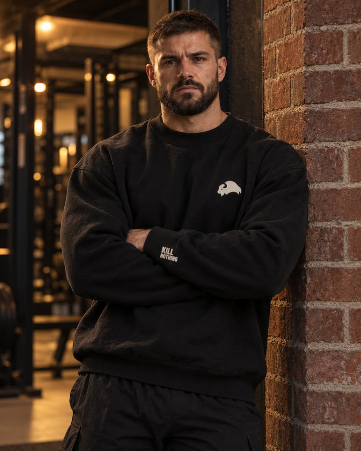Embroidered Bison - Crewneck Sweatshirt, black, worn by an athlete in the gym (AI-generated image)