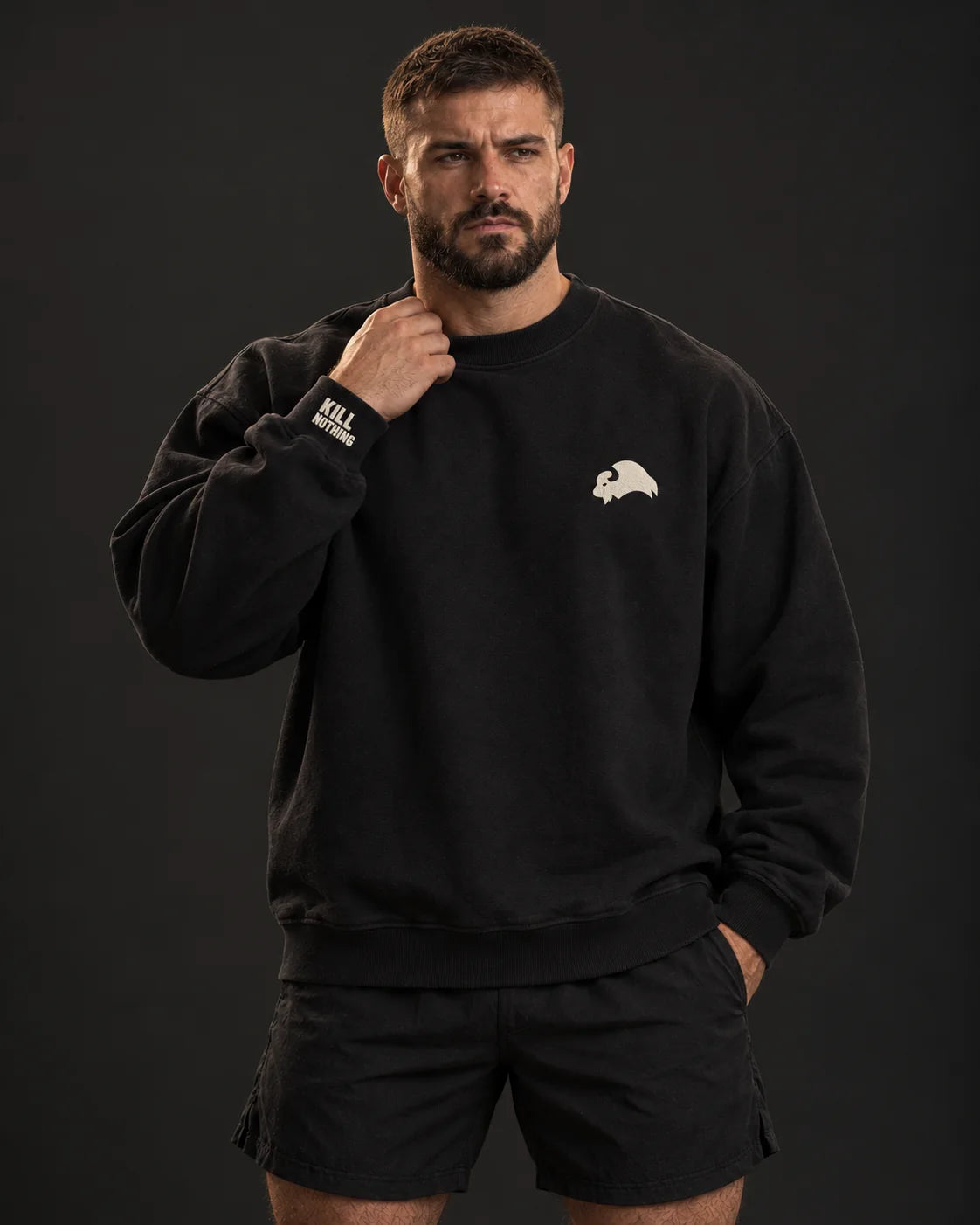 Embroidered Bison - Crewneck Sweatshirt, black, worn by an athlete, studio photo (AI-generated image)