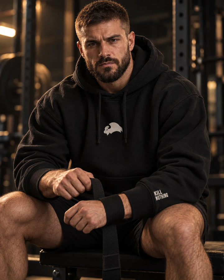 Embroidered Bison - Hoodie, black, worn by an athlete in the gym (AI-generated image)