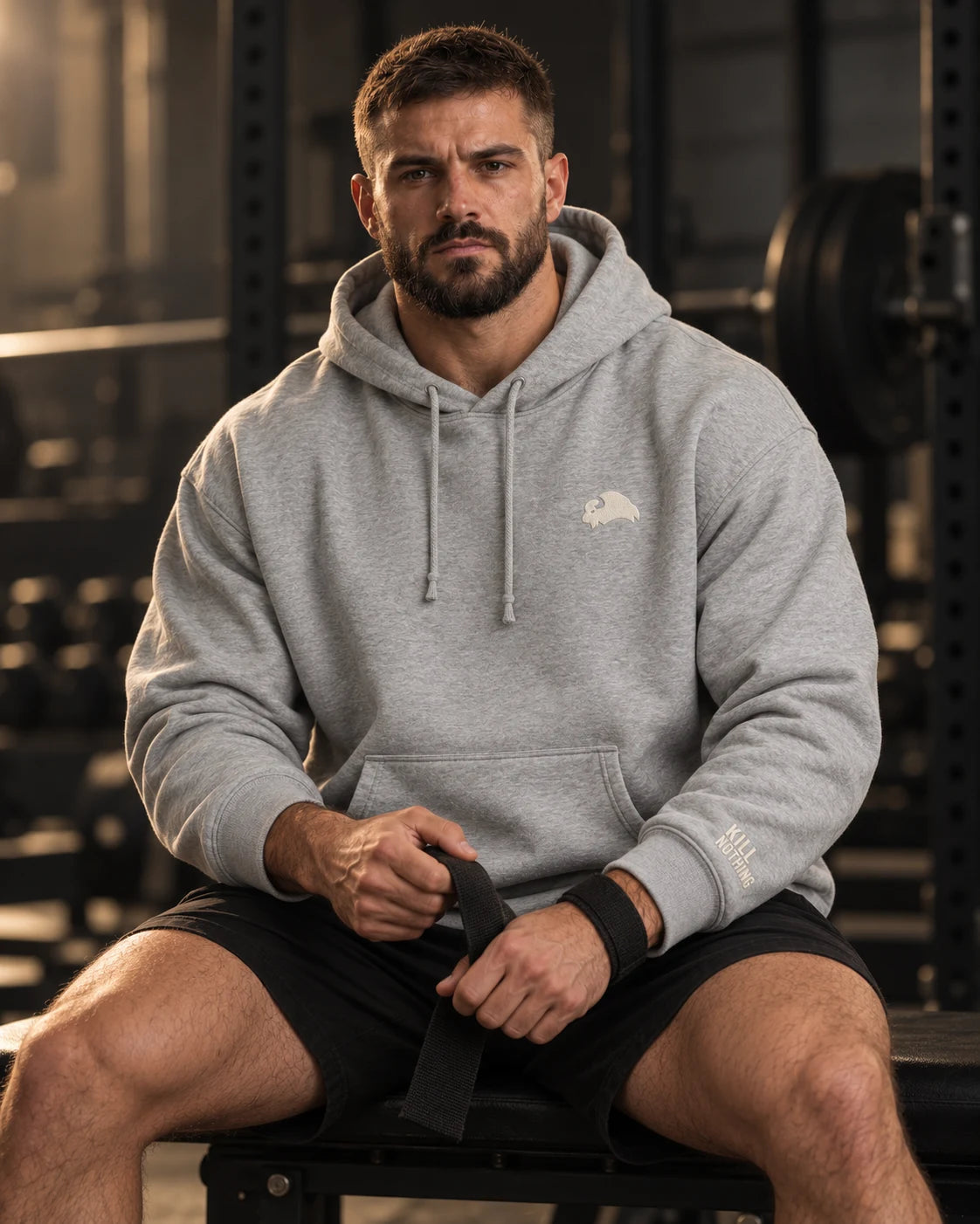 Embroidered Bison - Hoodie, heather grey, worn by an athlete in the gym (AI-generated image)