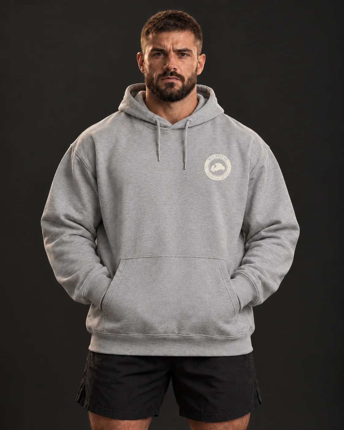Embroidered Bison - Hoodie, heather grey, worn by an athlete, studio photo (AI-generated image)