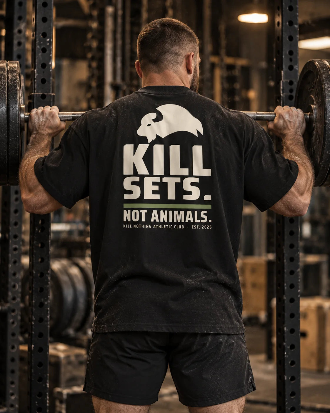 Kill Sets. Not Animals. - Oversized Tee, black, worn by an athlete in the gym (AI-generated image)