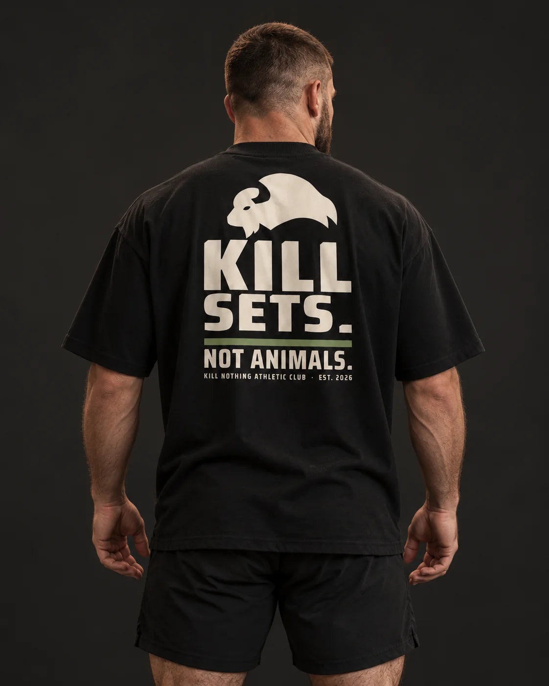 Kill Sets. Not Animals. - Oversized Tee, black, worn by an athlete, studio photo (AI-generated image)