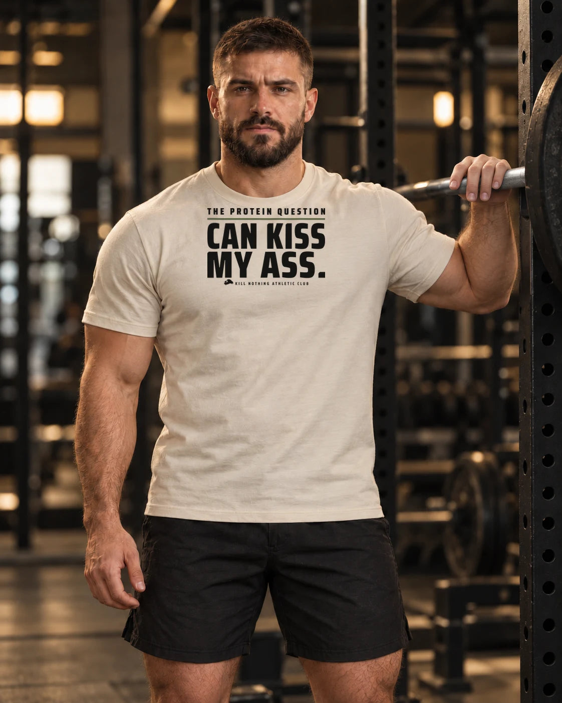 The Protein Question - Slim Tee, cream, worn by an athlete in the gym (AI-generated image)