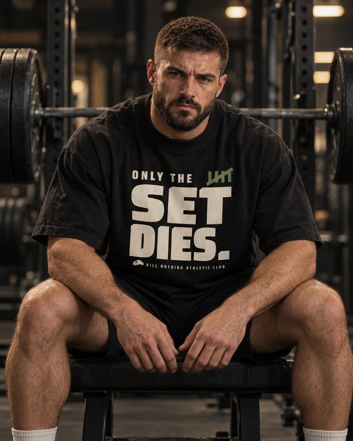 Only The Set Dies. - Oversized Tee, black, worn by an athlete in the gym (AI-generated image)