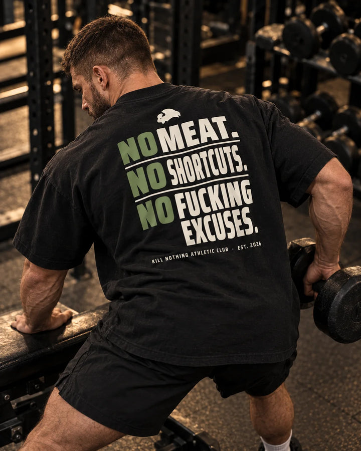 No Meat. No Shortcuts. - Oversized Tee, black, worn by an athlete in the gym (AI-generated image)