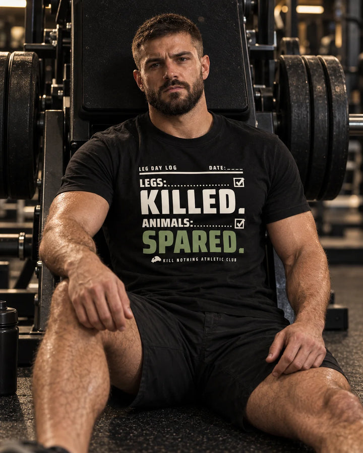 Legs: Killed. - Slim Tee, black, worn by an athlete in the gym (AI-generated image)