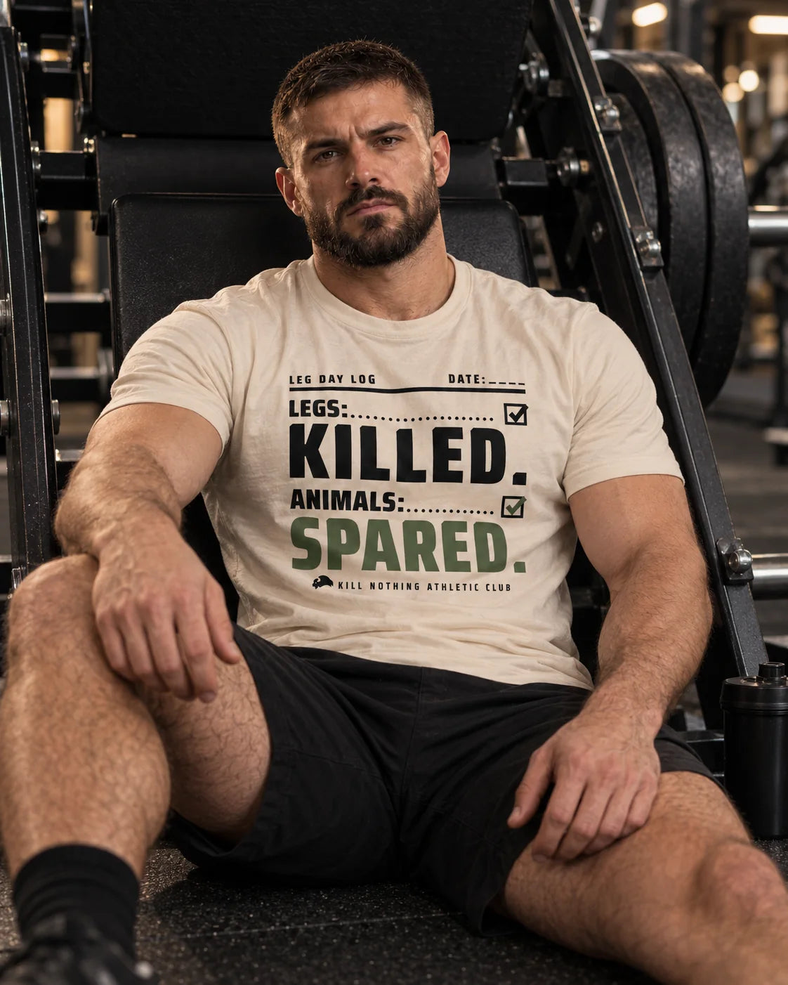 Legs: Killed. - Slim Tee, cream, worn by an athlete in the gym (AI-generated image)