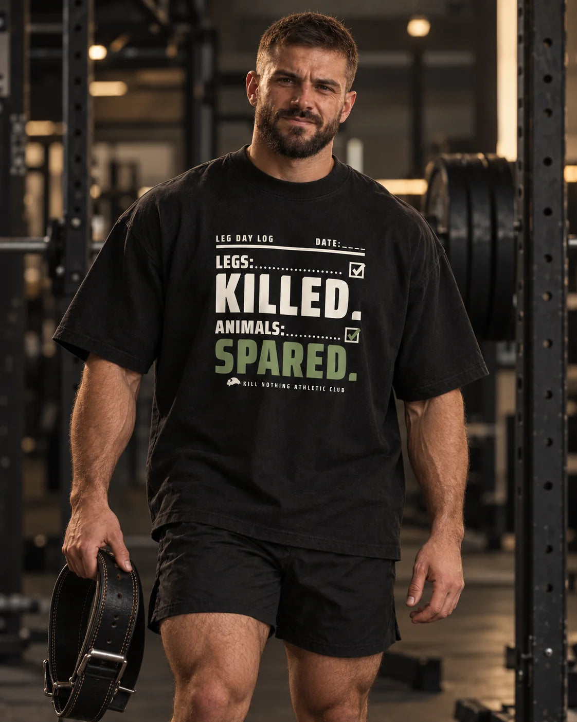 Legs: Killed. - Oversized Tee, black, worn by an athlete in the gym (AI-generated image)