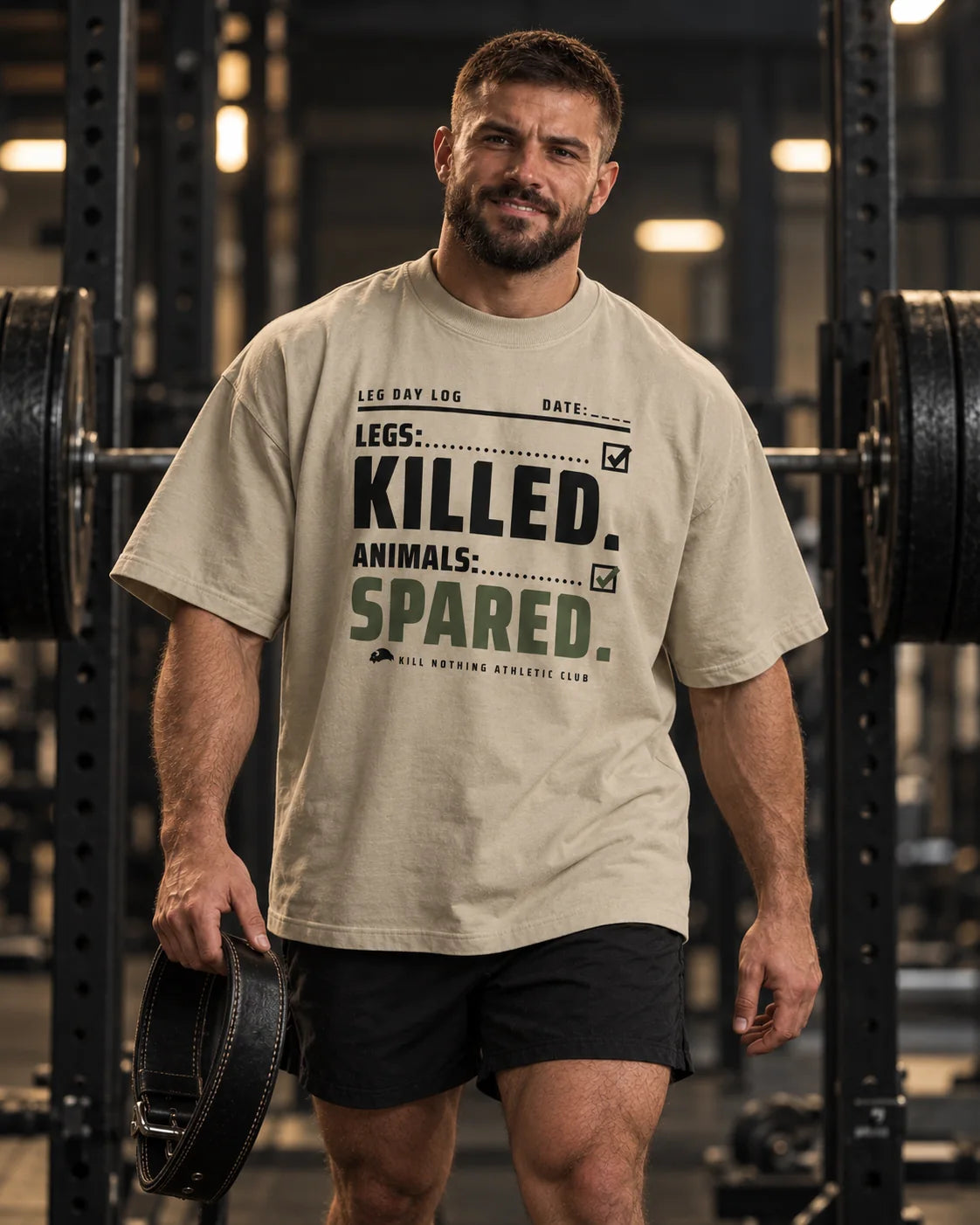 Legs: Killed. - Oversized Tee, stone, worn by an athlete in the gym (AI-generated image)